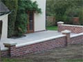 New paving and brick wall