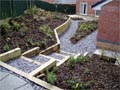 Garden steps with retaining wall and garden bedding